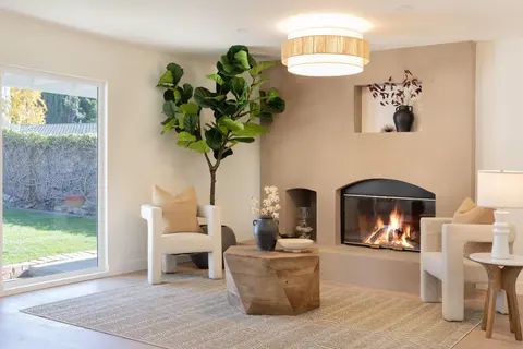 ADU living space with a fireplace and natural light