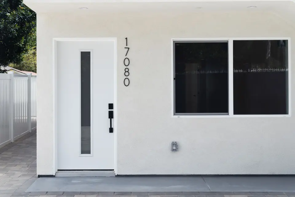 Modern ADU exterior with light stucco and contemporary entrance