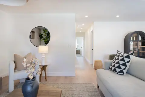 ADU living space with sofa and oak flooring